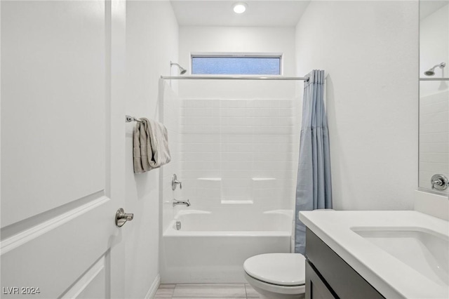 full bathroom with vanity, shower / tub combo, and toilet