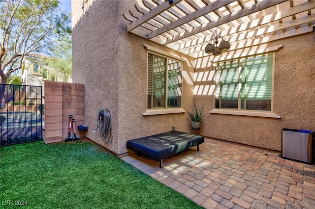 view of side of home featuring a pergola, a patio area, and a yard