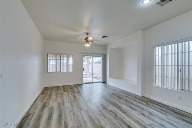 spare room with light hardwood / wood-style floors and ceiling fan