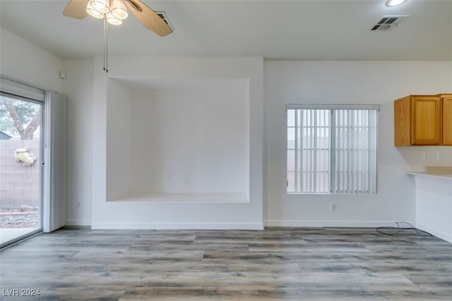 interior space with light wood-type flooring and ceiling fan