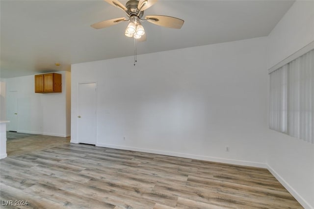 6214 Osaka Pearl St, North Las Vegas, NV 89031 - empty room with a ceiling fan and light wood-style flooring