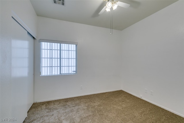 carpeted empty room with ceiling fan