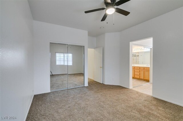 6214 Osaka Pearl St, North Las Vegas, NV 89031 - unfurnished bedroom featuring light carpet, a closet, ensuite bath, and a ceiling fan