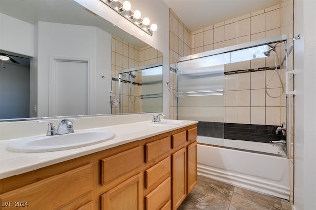 bathroom featuring vanity and combined bath / shower with glass door