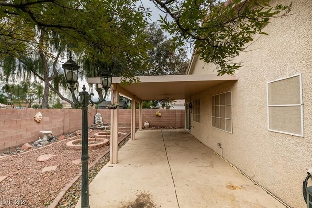 6214 Osaka Pearl St, North Las Vegas, NV 89031 - fenced backyard with a patio
