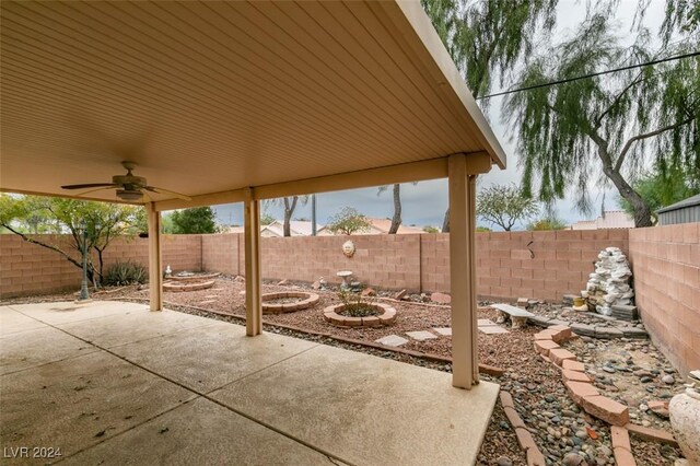 6214 Osaka Pearl St, North Las Vegas, NV 89031 - fenced backyard featuring a patio area and a ceiling fan