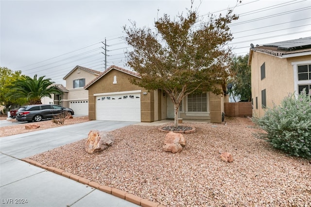 view of front of property featuring a garage