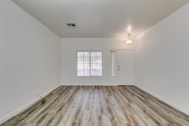 spare room featuring light wood-type flooring