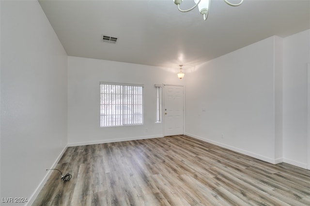 spare room with light hardwood / wood-style floors