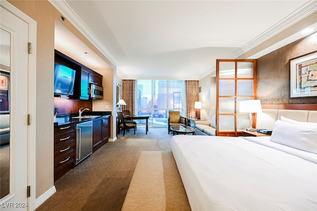 bedroom featuring ornamental molding and sink