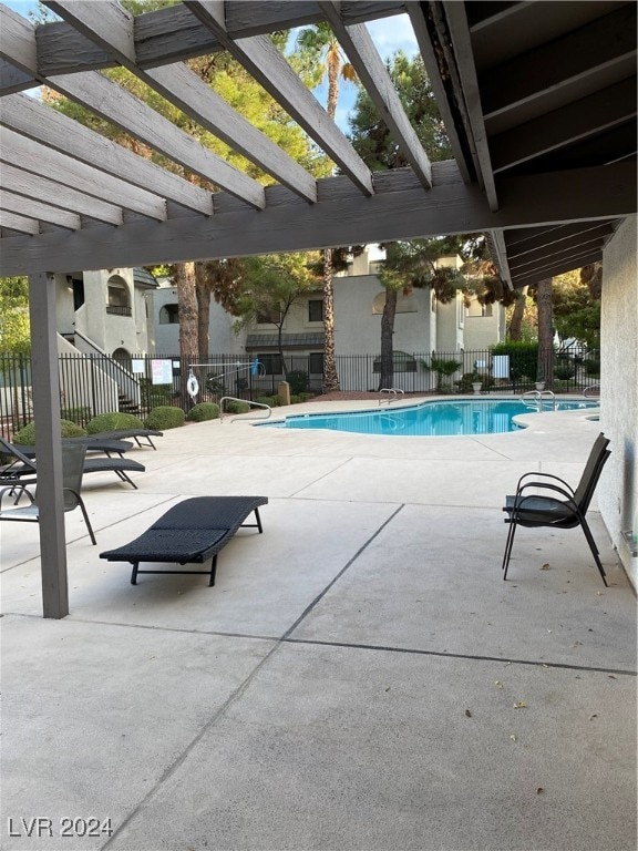 view of swimming pool with a patio