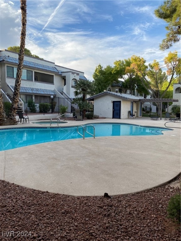 view of swimming pool featuring a patio