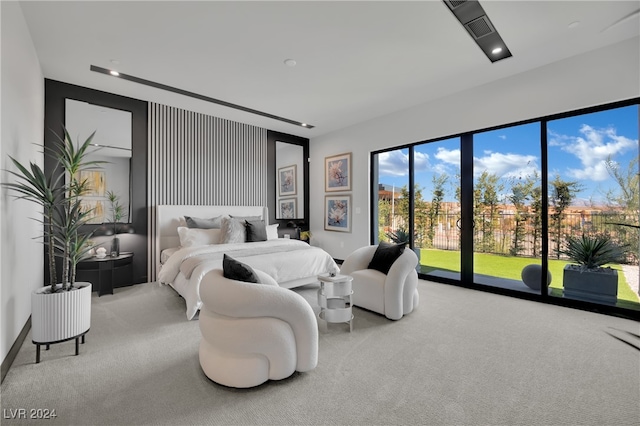 carpeted bedroom featuring access to outside