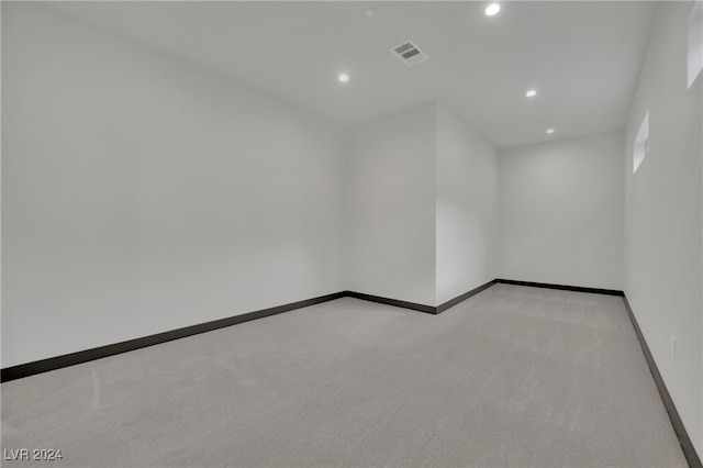 empty room with light colored carpet