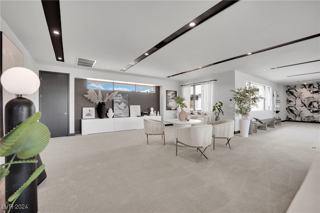 carpeted dining area with a healthy amount of sunlight