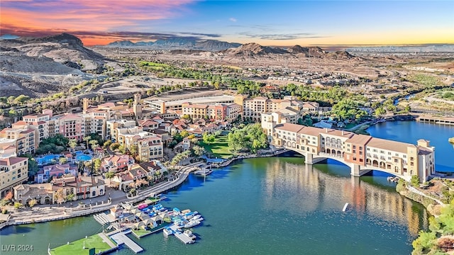 aerial view at dusk with a water and mountain view