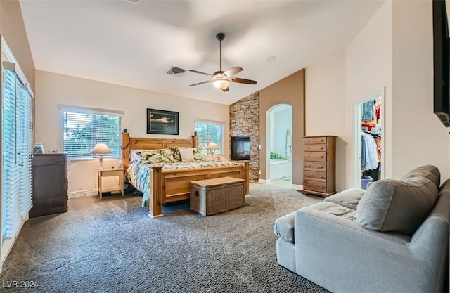 carpeted bedroom with vaulted ceiling and ceiling fan