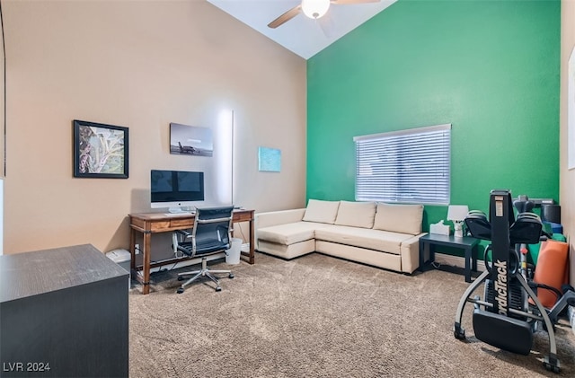 carpeted office space with high vaulted ceiling and ceiling fan