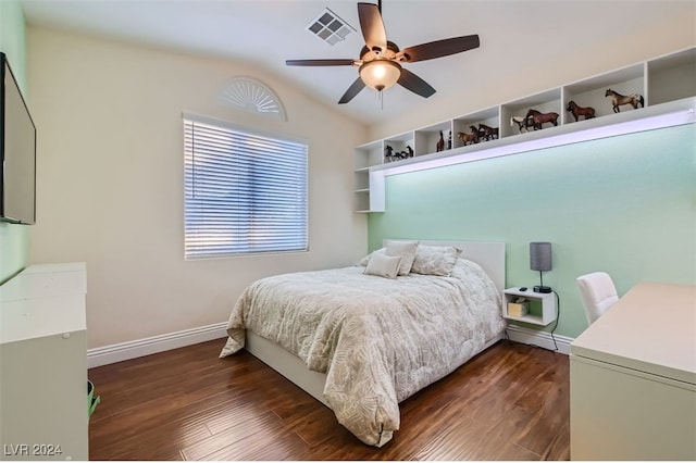 bedroom with dark hardwood / wood-style floors and ceiling fan