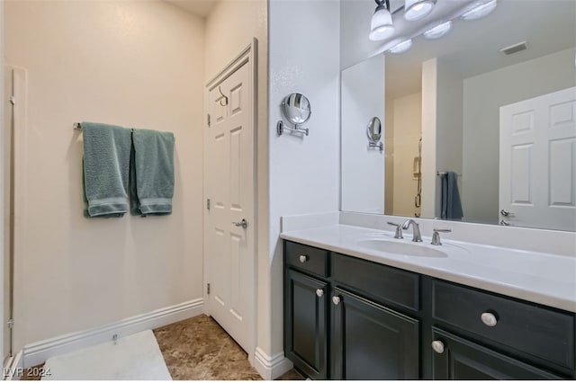 bathroom with vanity and tile patterned floors