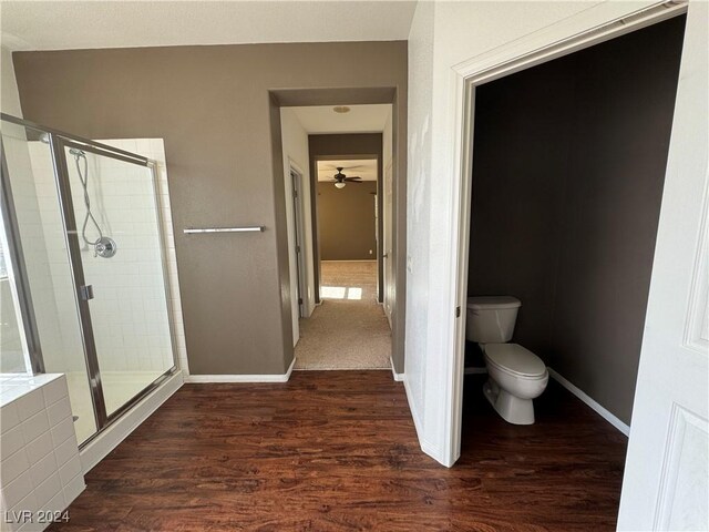 bathroom featuring walk in shower, hardwood / wood-style flooring, ceiling fan, and toilet