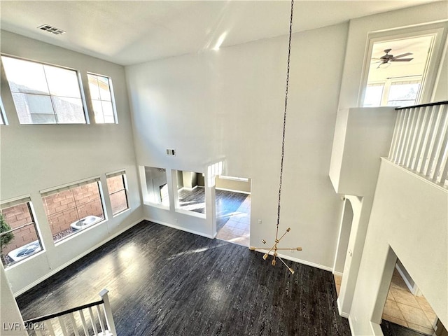 spare room featuring dark hardwood / wood-style floors and ceiling fan