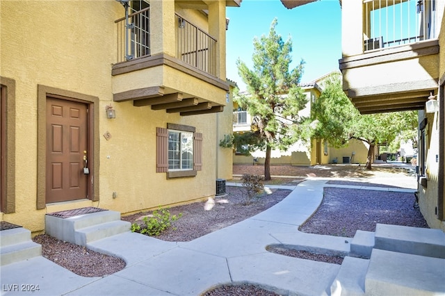 property entrance with a balcony