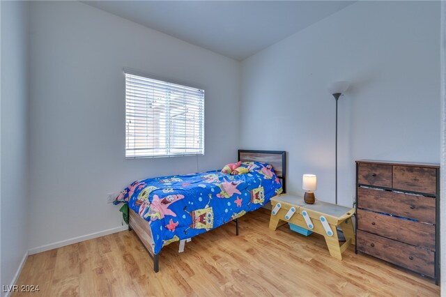 bedroom featuring hardwood / wood-style floors