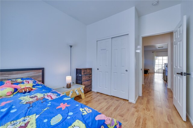 bedroom featuring hardwood / wood-style flooring and a closet