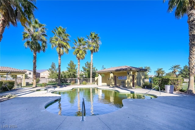 view of swimming pool featuring a patio area