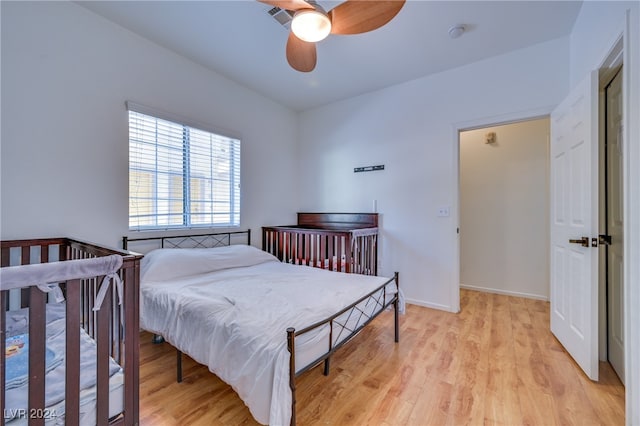 bedroom featuring ceiling fan and light hardwood / wood-style floors