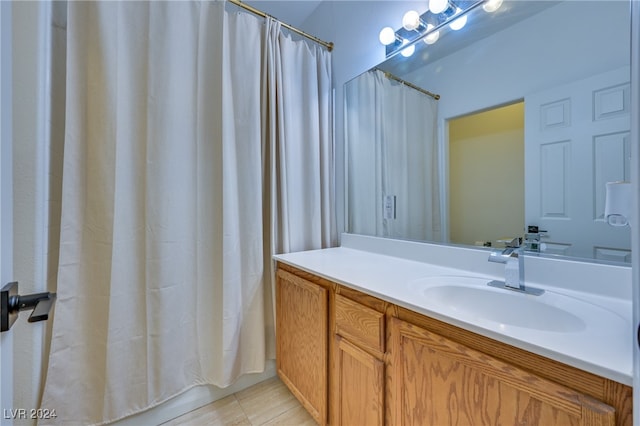 bathroom with tile patterned floors and vanity