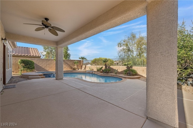 view of swimming pool with a patio and ceiling fan