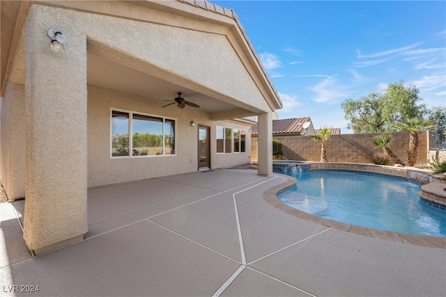 view of pool with ceiling fan and a patio area