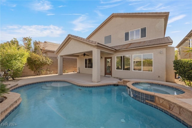 view of swimming pool featuring ceiling fan, an in ground hot tub, and a patio area