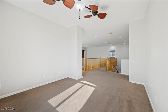 empty room with carpet and ceiling fan