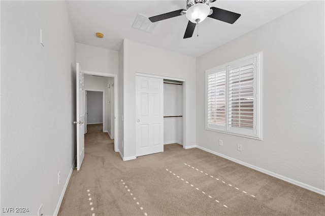 unfurnished bedroom featuring a closet, ceiling fan, and carpet floors