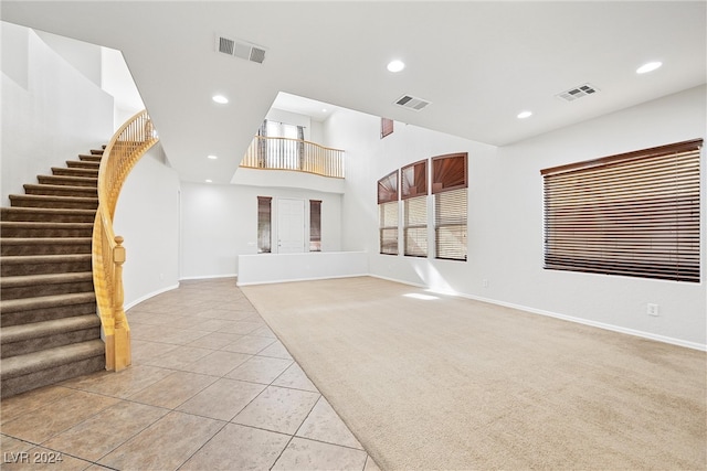 unfurnished living room with light tile patterned flooring