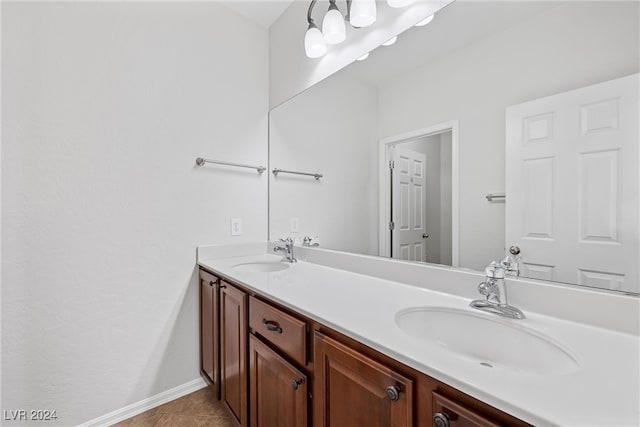 bathroom with tile patterned flooring and vanity