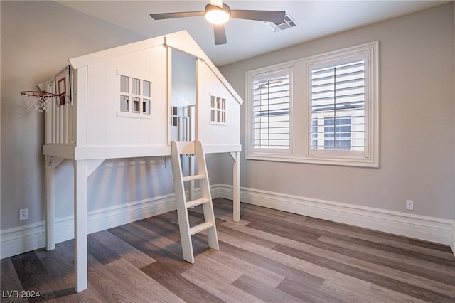 bedroom with hardwood / wood-style flooring and ceiling fan