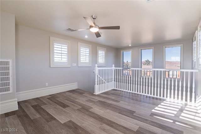 unfurnished room with hardwood / wood-style floors and ceiling fan