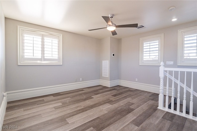 empty room with ceiling fan and wood-type flooring