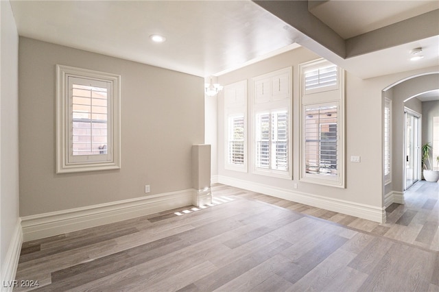 spare room with light hardwood / wood-style floors