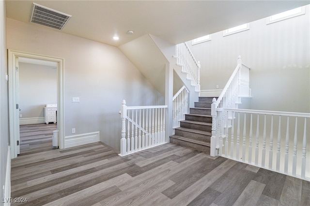 stairway featuring wood-type flooring