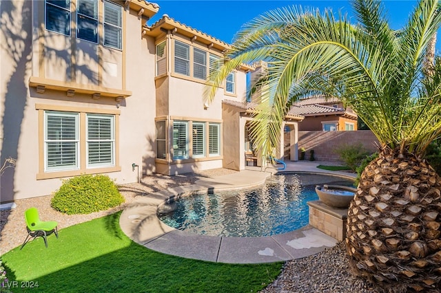 view of swimming pool with a patio area