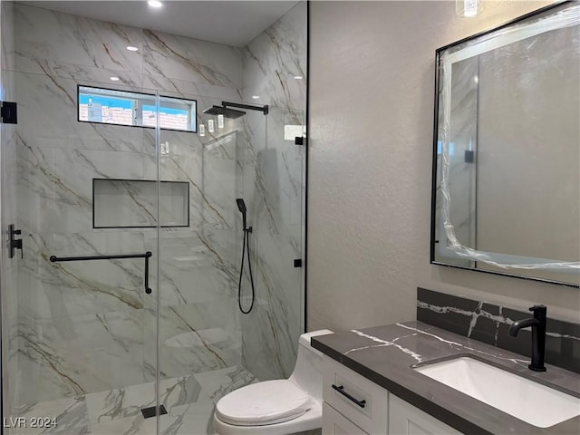 bathroom with toilet, walk in shower, and vanity