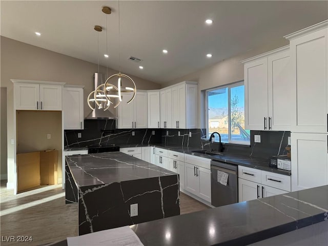 kitchen with dishwasher, vaulted ceiling, a center island, decorative light fixtures, and sink