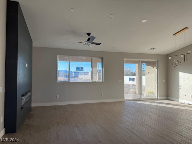 unfurnished living room with hardwood / wood-style floors and ceiling fan