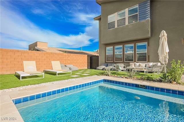 view of swimming pool featuring outdoor lounge area and a patio