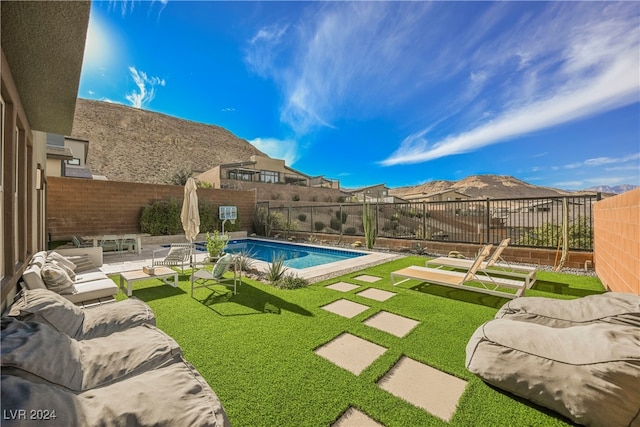 view of pool featuring a patio and a lawn